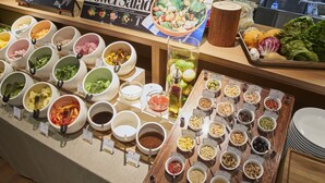 A buffet with various food items and condiments. - Iroha Grand Hotel (Matsumoto)