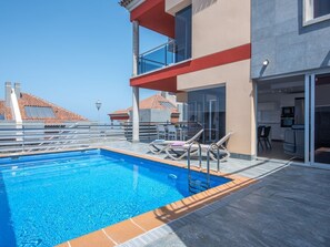 Outdoor pool, a heated pool, sun loungers