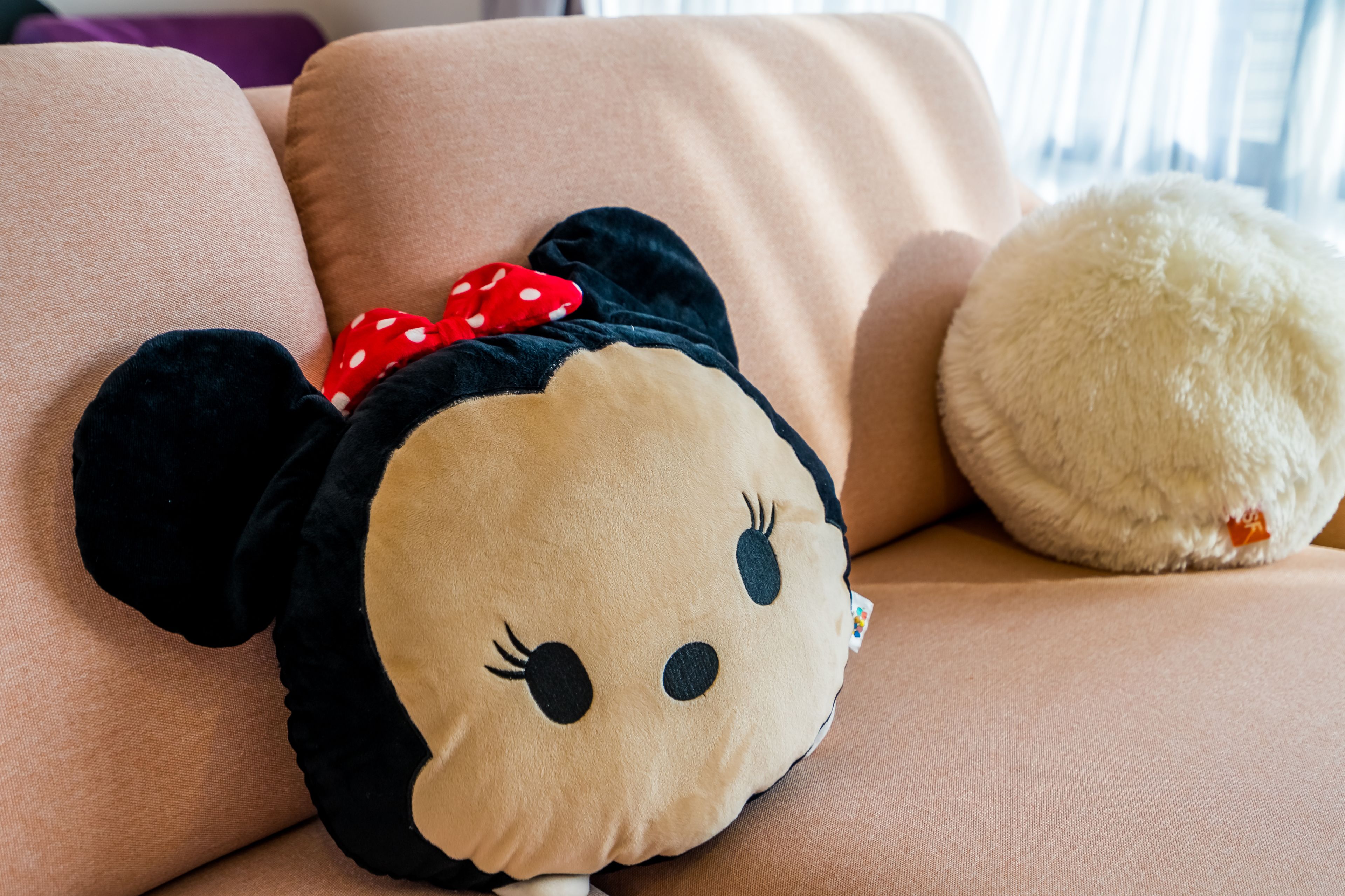 A plush toy on a sofa.