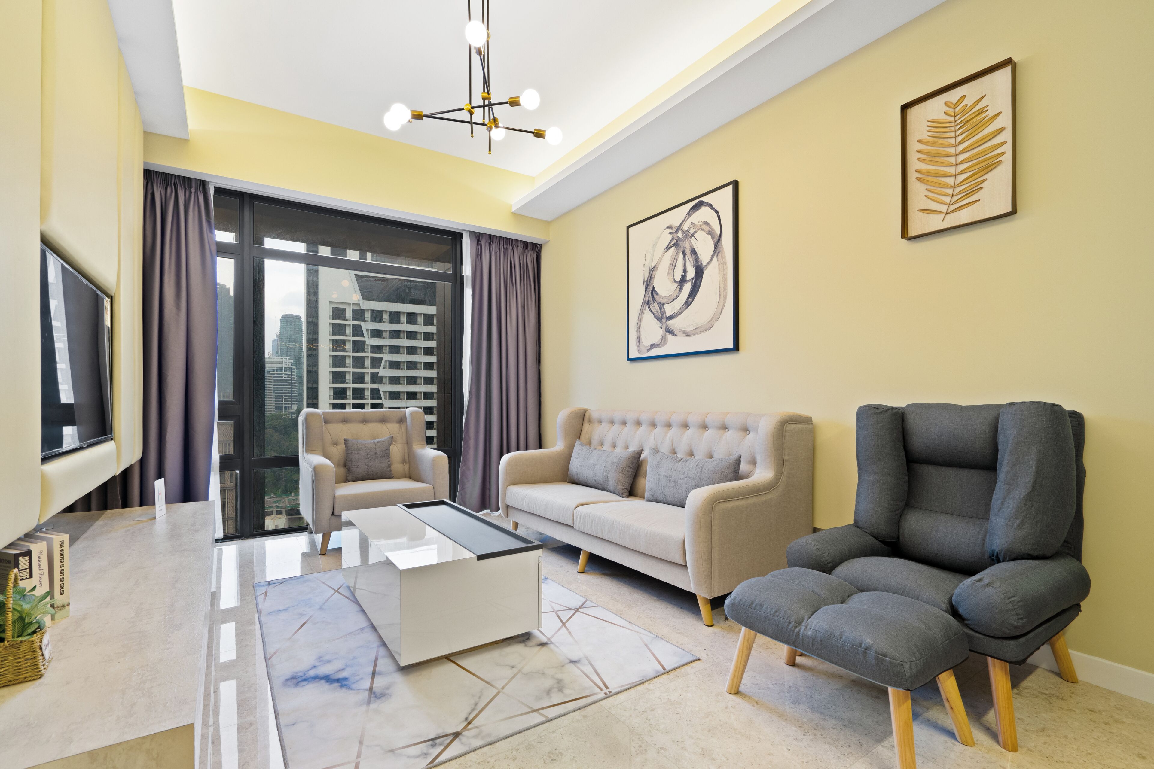 A modern living room with a sofa, armchair, and coffee table.