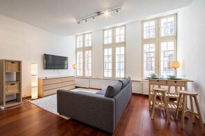 Executive Apartment, 1 Bedroom, City View | Living area | 65-inch LCD TV with premium TV channels, TV, Netflix