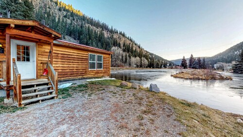 Waterfront cabin with private hot tub, furnished deck, wood stove, & free WiFi