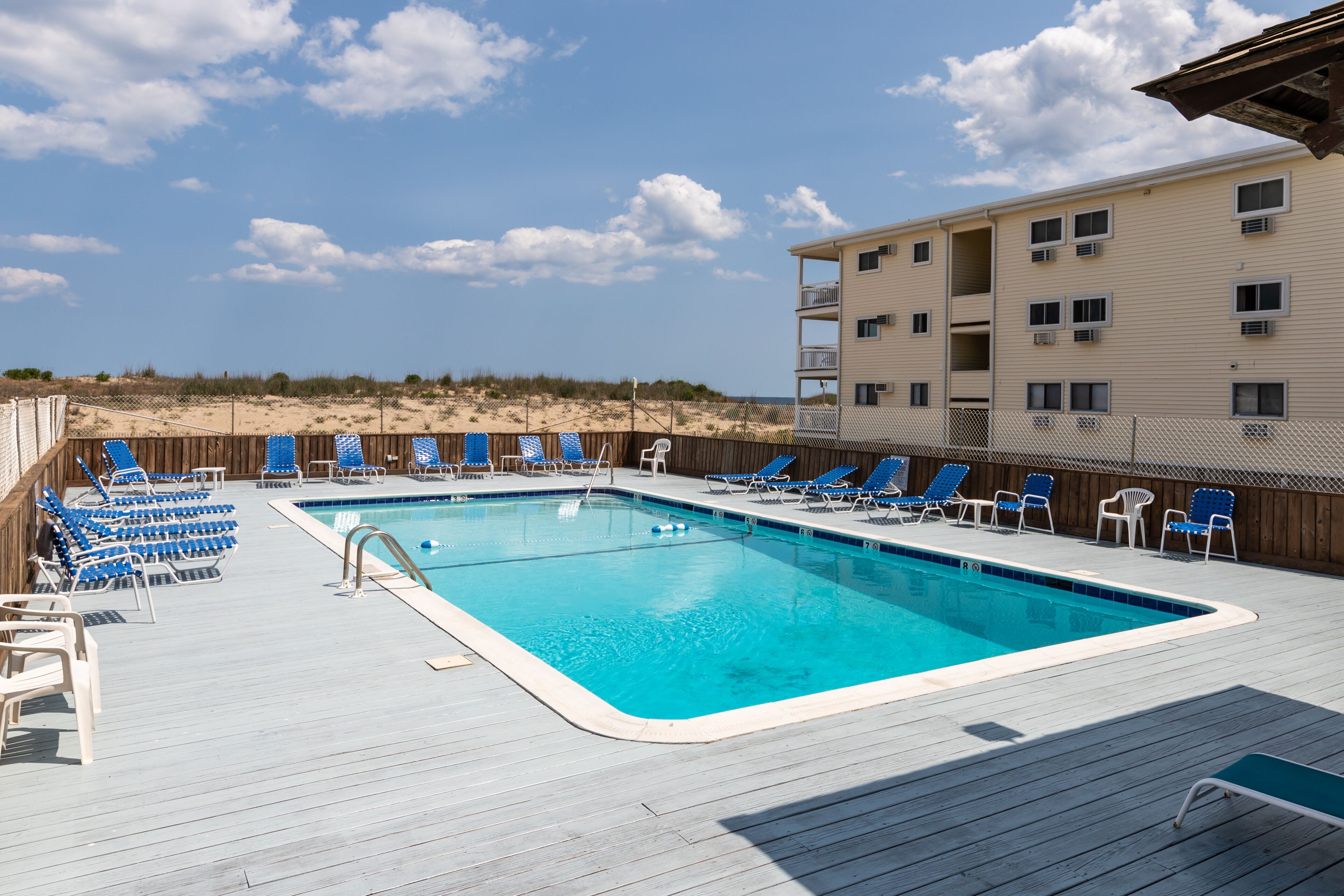 Oceanfront condo with enclosed balcony & pool - steps to beach