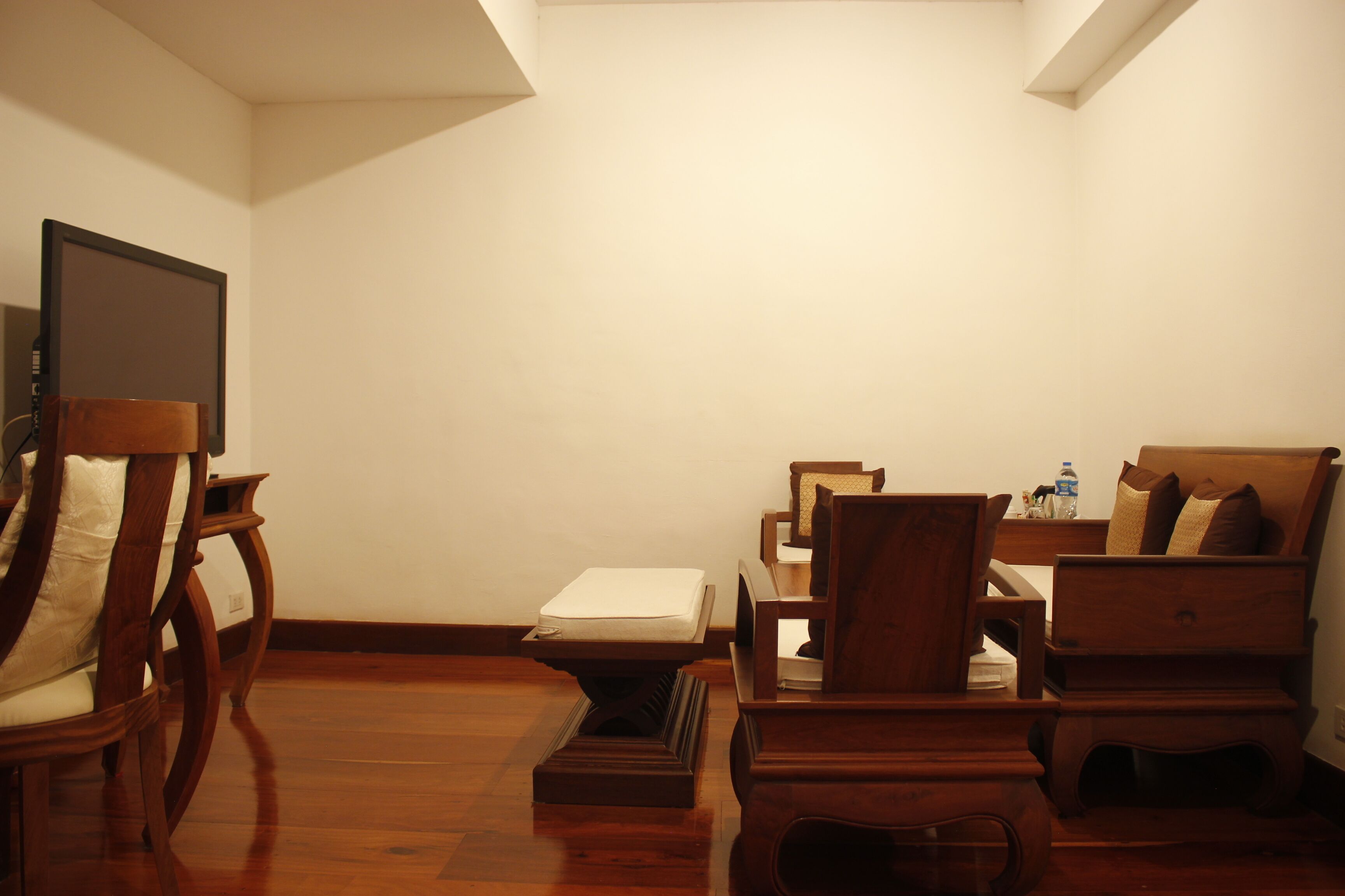 chanthapanya suite | living area | 32-inch flat-screen tv with cable channels, tv