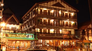 A multi-story building with balconies and a sign that reads "CHANTHAPANY". - Chanthapanya Hotel (Vientiane)