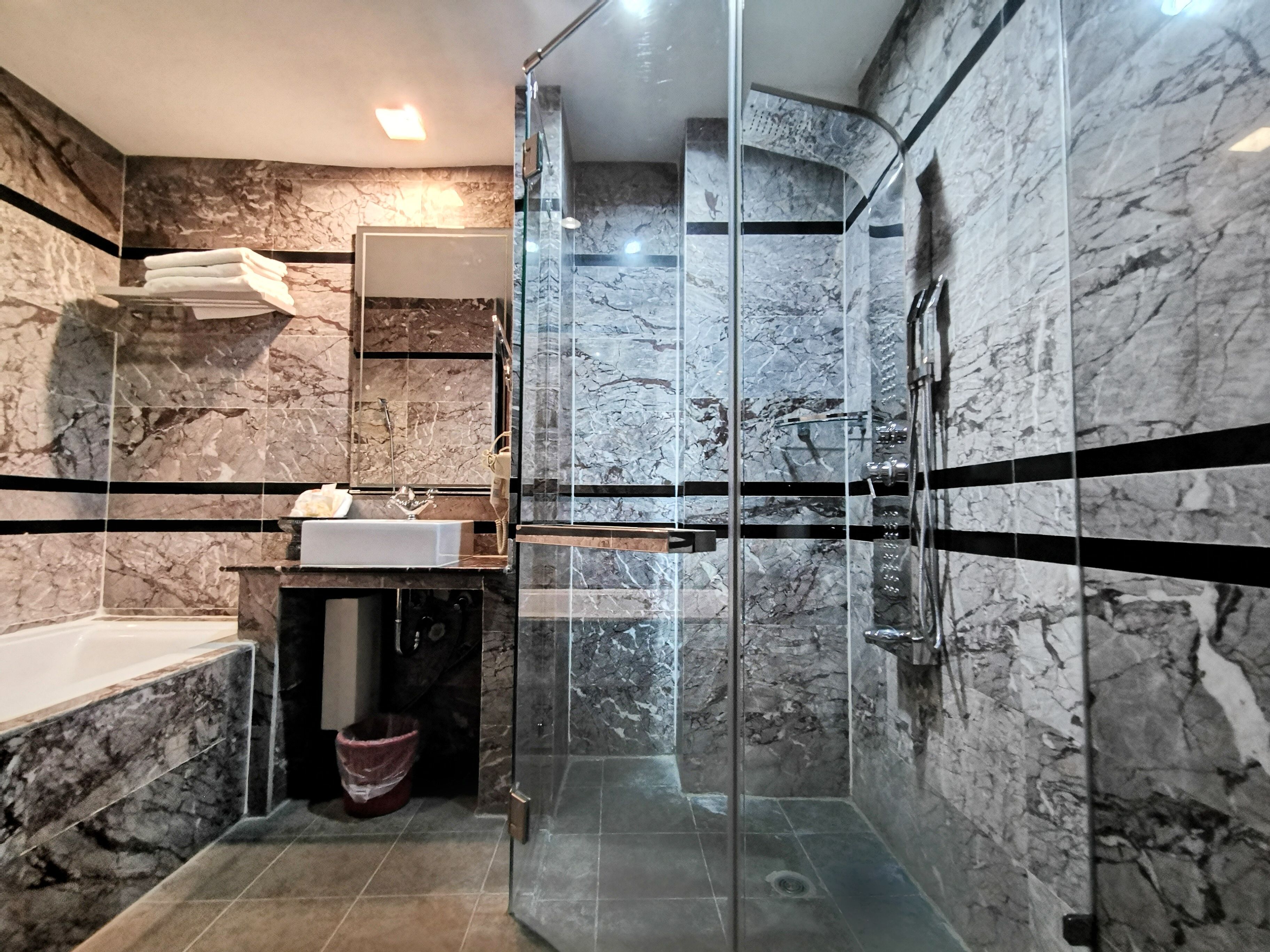 family room | bathroom | shower, free toiletries, slippers, bidet