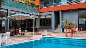 Outdoor pool, open 6:00 AM to 6:00 PM, pool umbrellas, sun loungers