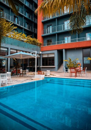 Outdoor pool, open 6:00 AM to 6:00 PM, pool umbrellas, sun loungers
