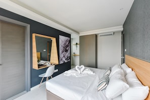 Suite, 2 chambres | Fer et planche à repasser, accès au Wi-Fi (inclus)