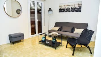 Apartment, 2 Bedrooms | Living room | Flat-screen TV