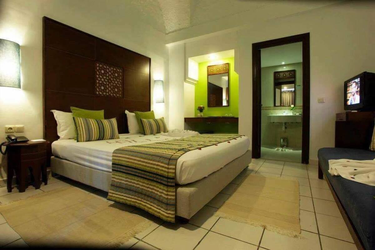 Family Quadruple Room | Blackout drapes, iron/ironing board (on request), bed sheets