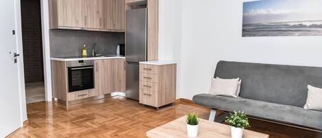 City-Apartment, 1 Schlafzimmer | Wohnbereich | Flachbildfernseher