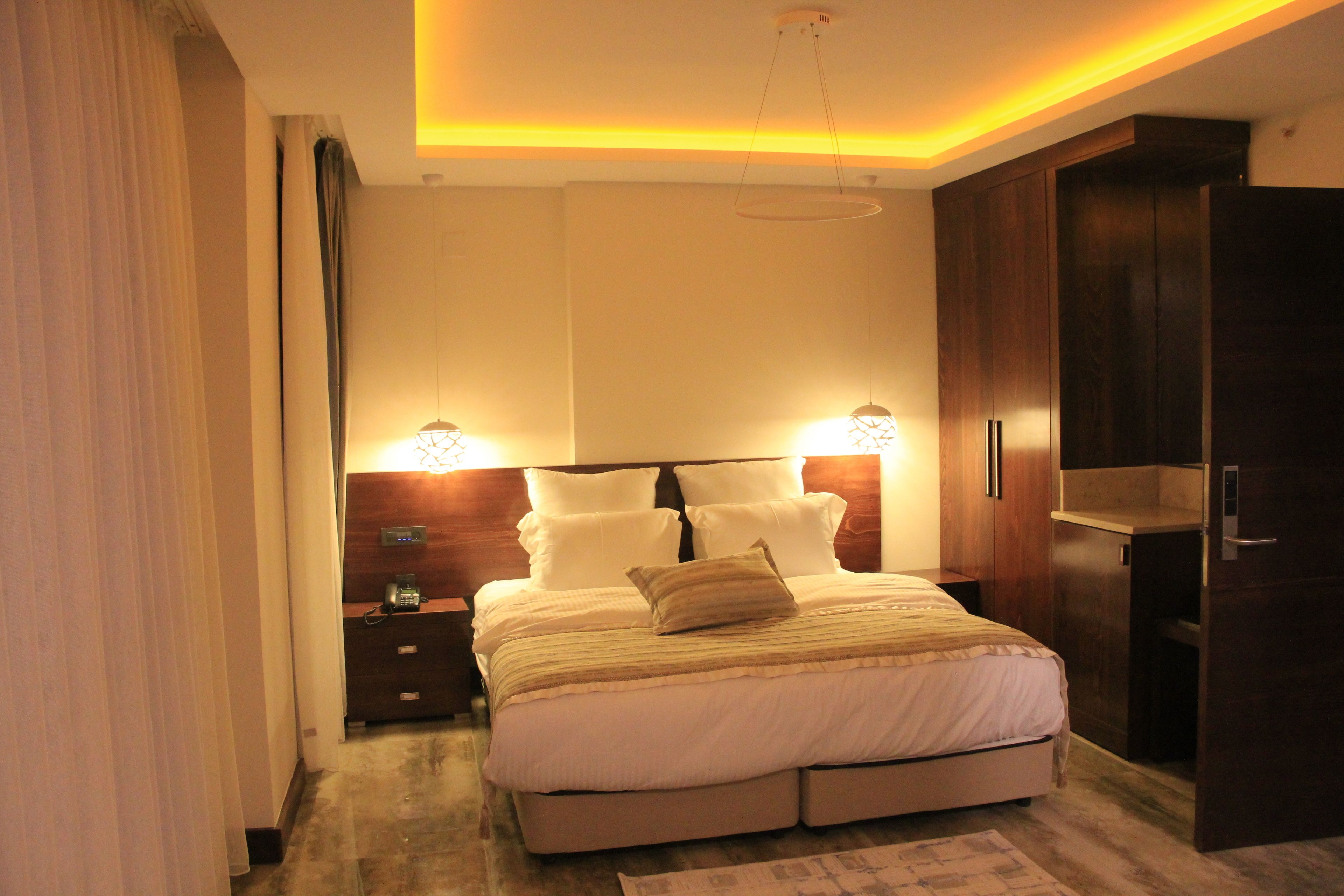 deluxe suite, city view | 1 bedroom, minibar, in-room safe, individually decorated