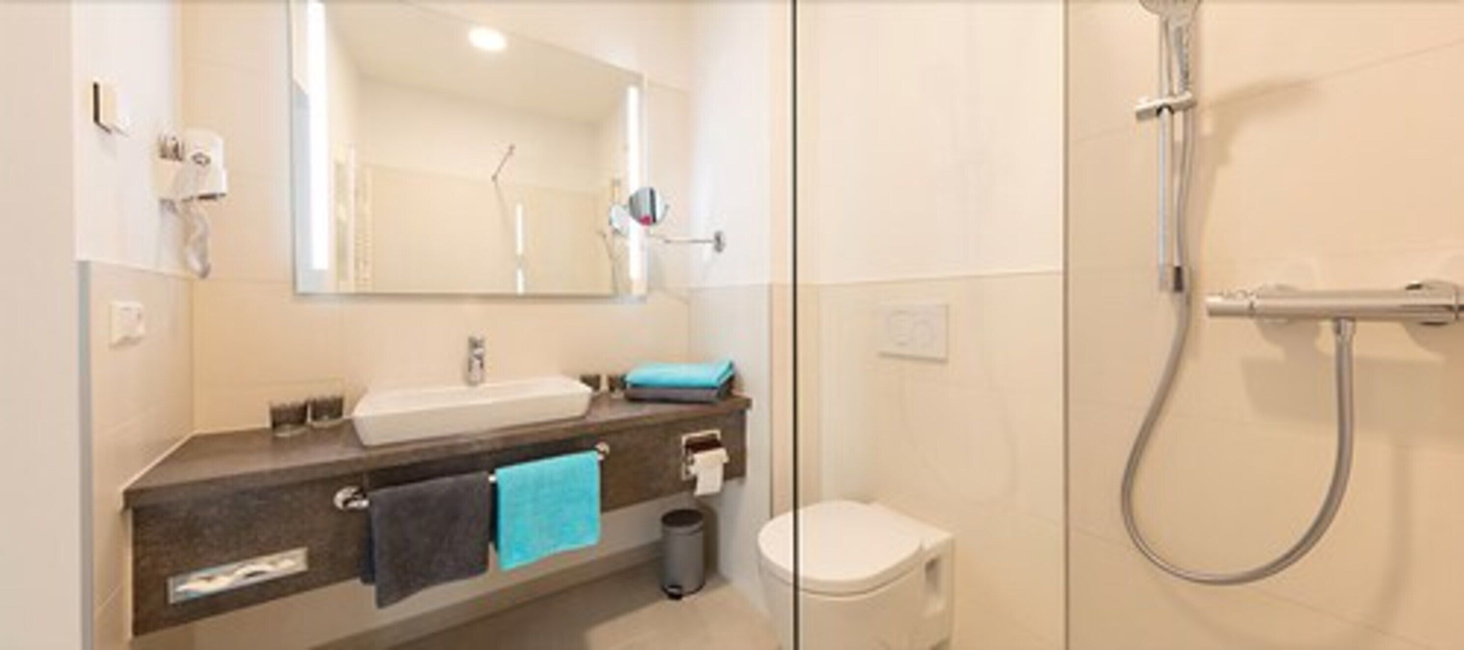 family room | bathroom | shower, hair dryer, towels, shampoo