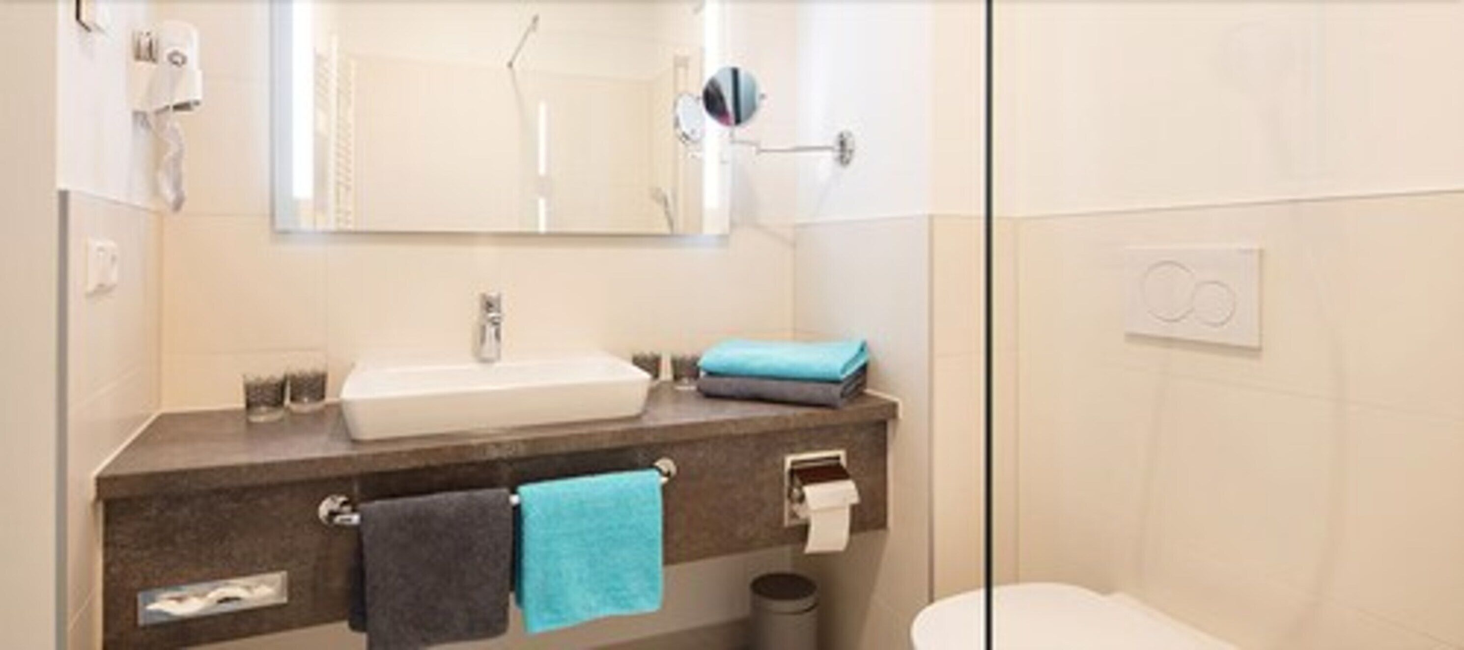 shower, hair dryer, towels, shampoo