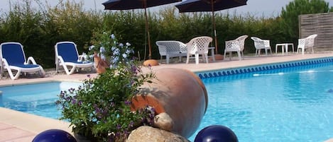 Seasonal outdoor pool, pool umbrellas, pool loungers