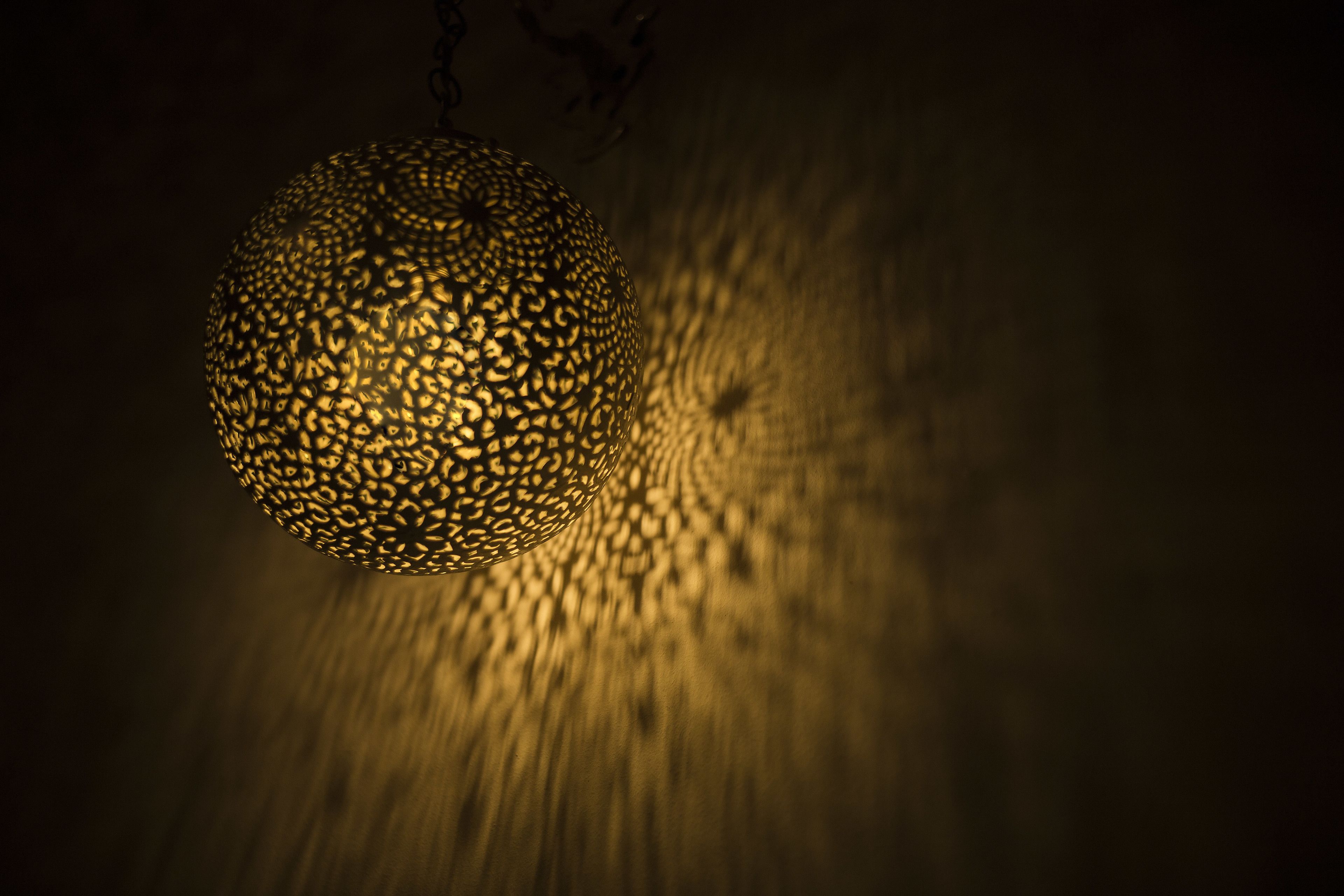 A spherical, intricately patterned light fixture.