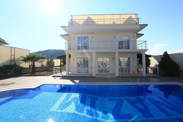 Outdoor pool, pool umbrellas, pool loungers