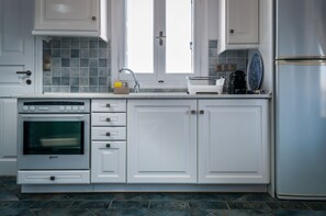 Apartment, Sea View | Private kitchen | Stovetop, coffee/tea maker, electric kettle, cookware/dishes/utensils