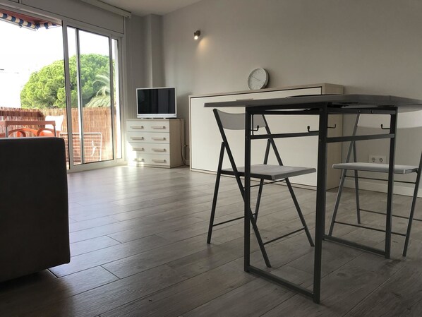 Apartment, 1 Bedroom | Living area | Flat-screen TV