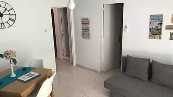 Apartment, 2 Bedrooms | Living room | Flat-screen TV