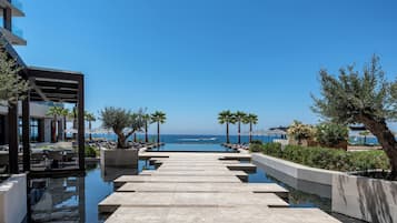Indoor pool, 2 outdoor pools, open 9:00 AM to 7:00 PM, pool umbrellas