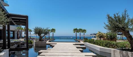 Indoor pool, 2 outdoor pools, open 9:00 AM to 7:00 PM, pool umbrellas