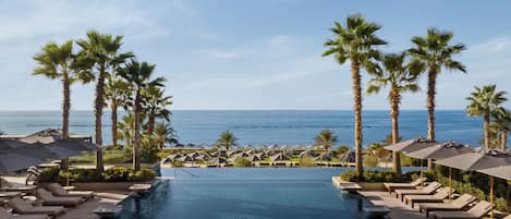Indoor pool, 2 outdoor pools, open 9:00 AM to 7:00 PM, pool umbrellas