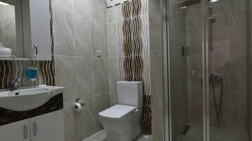 Shower, free toiletries, hair dryer, slippers