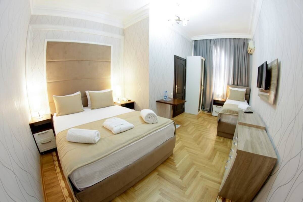 Habitación triple estándar | Tabla de planchar con plancha, cunas gratuitas y wifi gratis 