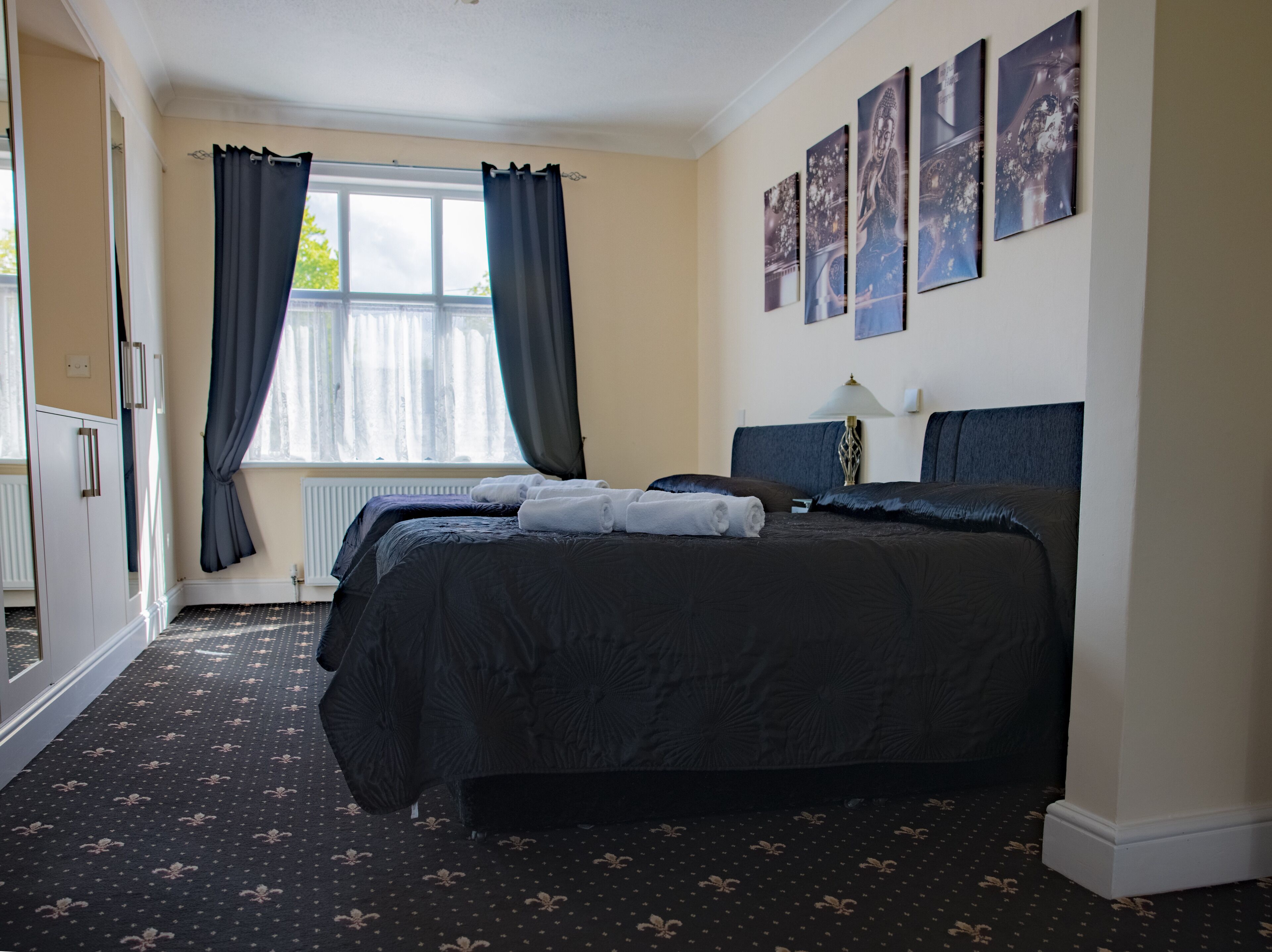 executive family room | blackout curtains, iron/ironing board, free wifi, bed sheets