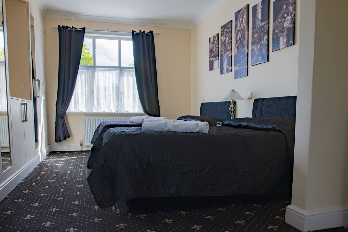 executive family room | blackout curtains, iron/ironing board, free wifi, bed sheets