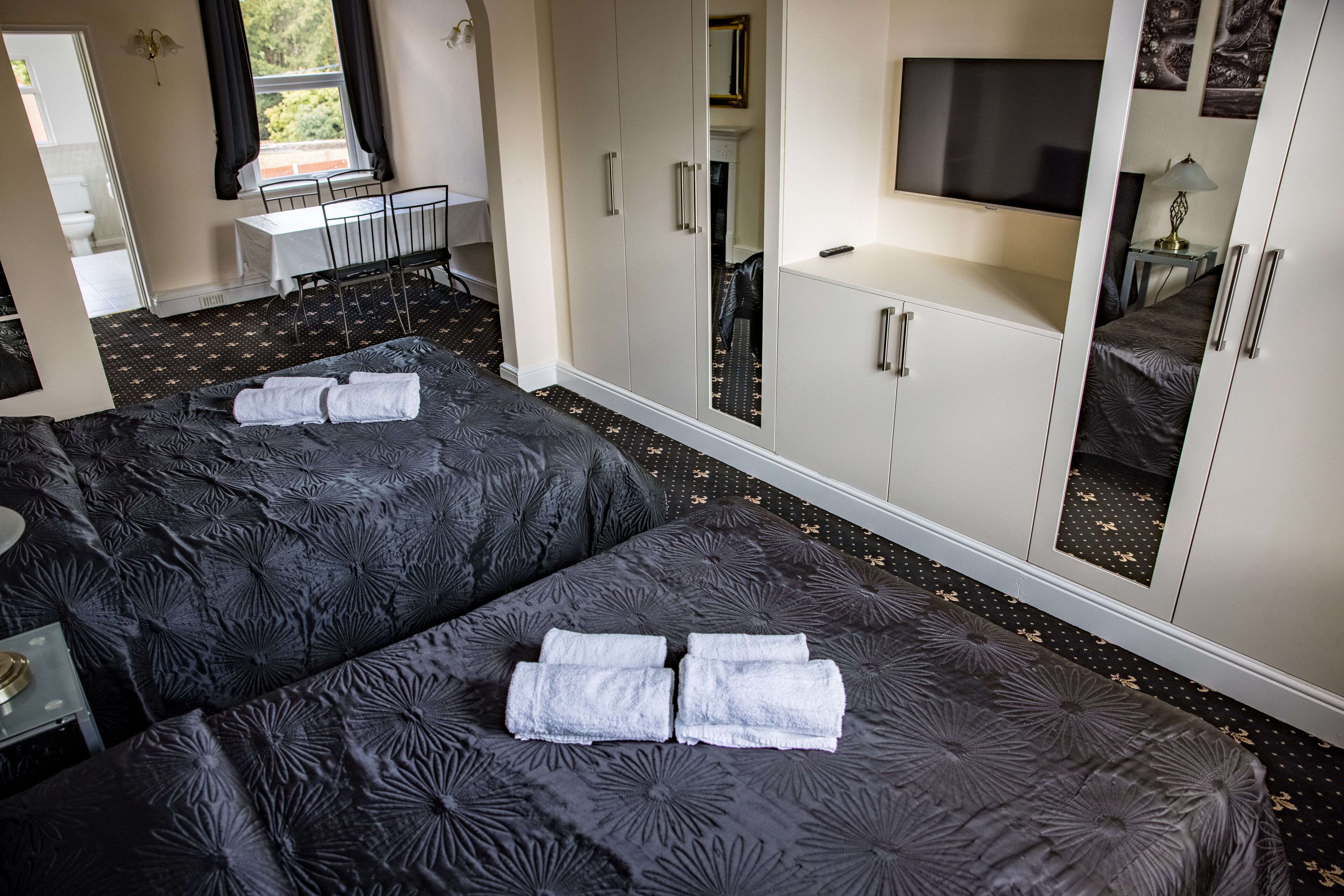 executive family room | blackout curtains, iron/ironing board, free wifi, bed sheets