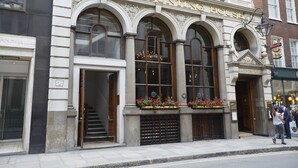 The Counting House building with arched windows and a sign above the entrance.