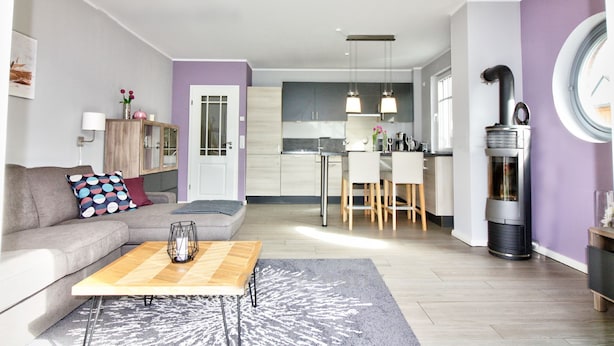 A modern apartment with a living room, kitchen, and dining area. - Carolin Dangast (Varel)