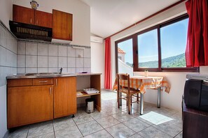 Apartment (Apartments Malo Lago - One-Bedroom Ap) | Private kitchenette | Fridge, stovetop, electric kettle, toaster