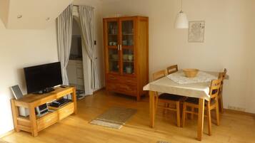 Apartment, 3 Bedrooms | Living room | 43-inch flat-screen TV with cable channels, TV, DVD player