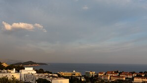 A coastal town with buildings, a church, and a view of the sea. - Guest House Nikolina (Dubrovnik)
