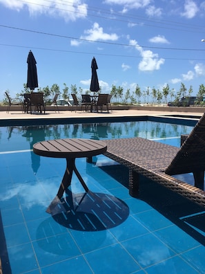 Outdoor pool, open 8:00 AM to 8:00 PM, pool umbrellas, sun loungers