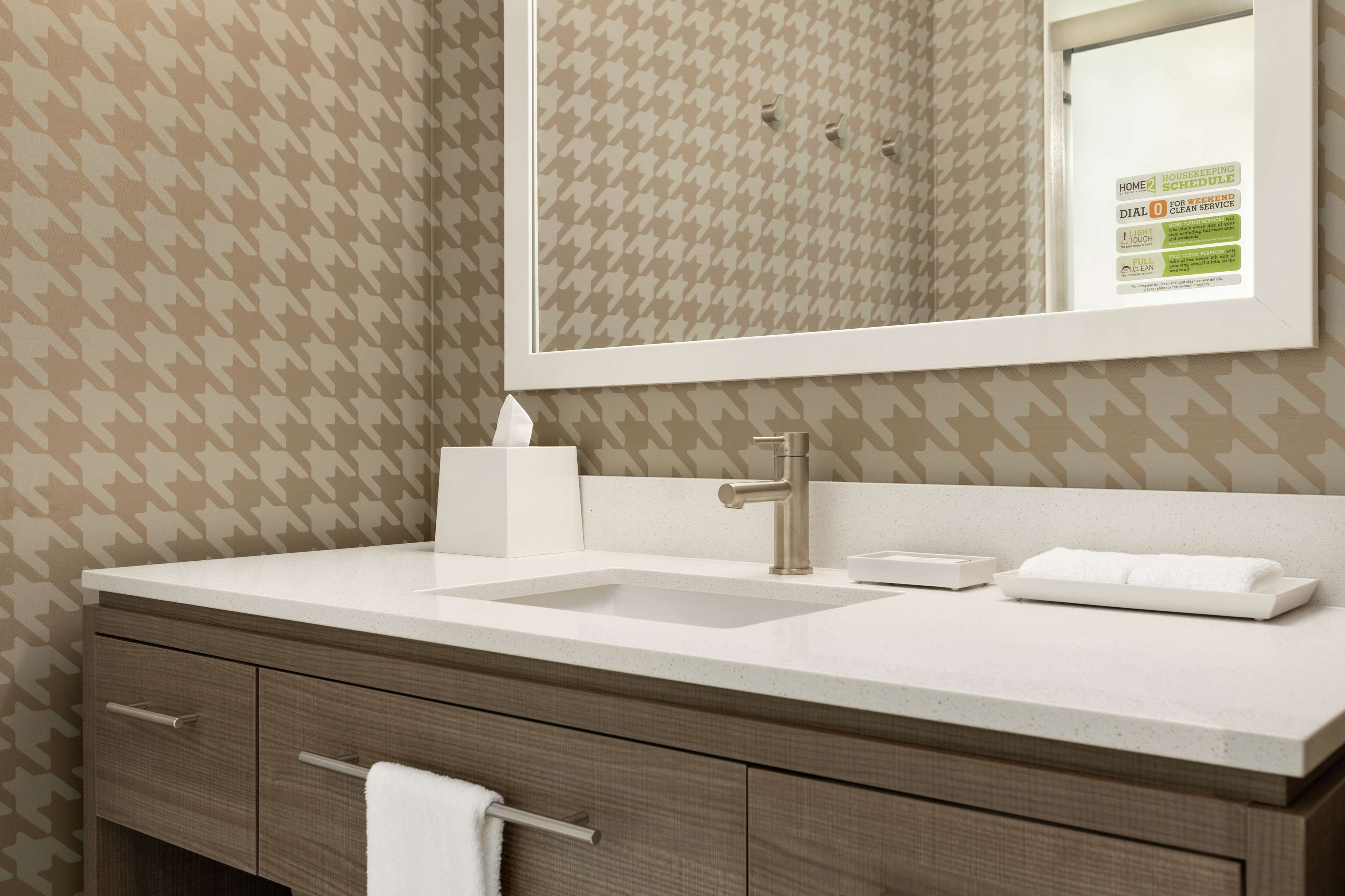 designer toiletries, hair dryer, towels, soap