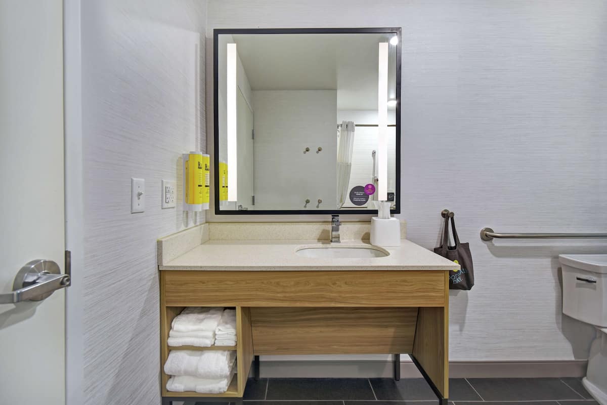 shower, designer toiletries, towels