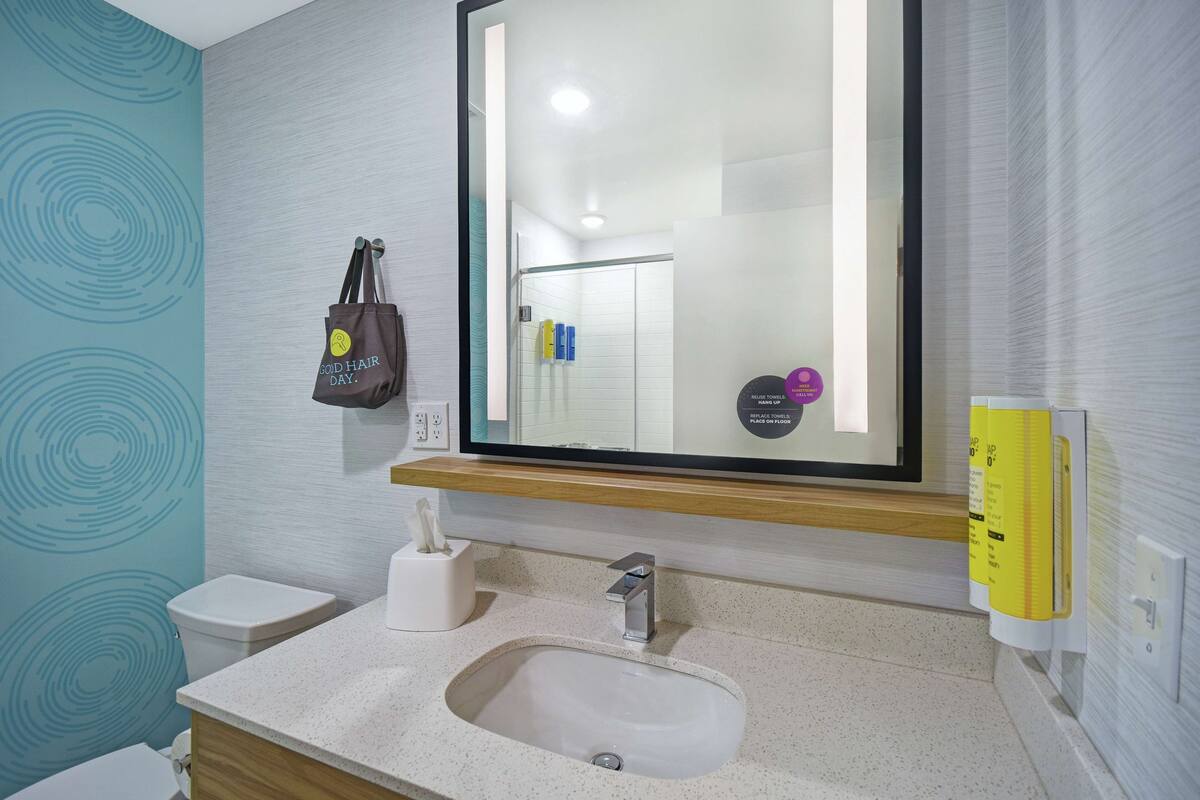 shower, designer toiletries, towels