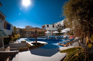 2 outdoor pools, open 7:00 AM to 10:00 PM, pool umbrellas, pool loungers