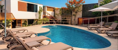 2 outdoor pools, open 7:00 AM to 10:00 PM, pool umbrellas, pool loungers