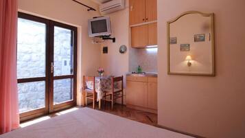 Studio (Apartments Magda- Standard Backside S) | Living room | Flat-screen TV