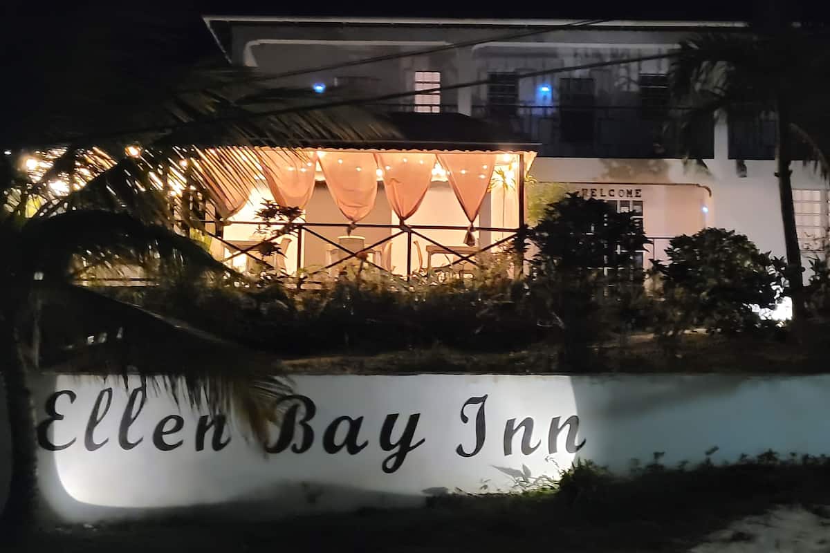 The exterior of Ellen Bay Inn with a sign indicating the name.