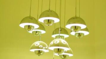 A ceiling with multiple hanging spherical light fixtures.