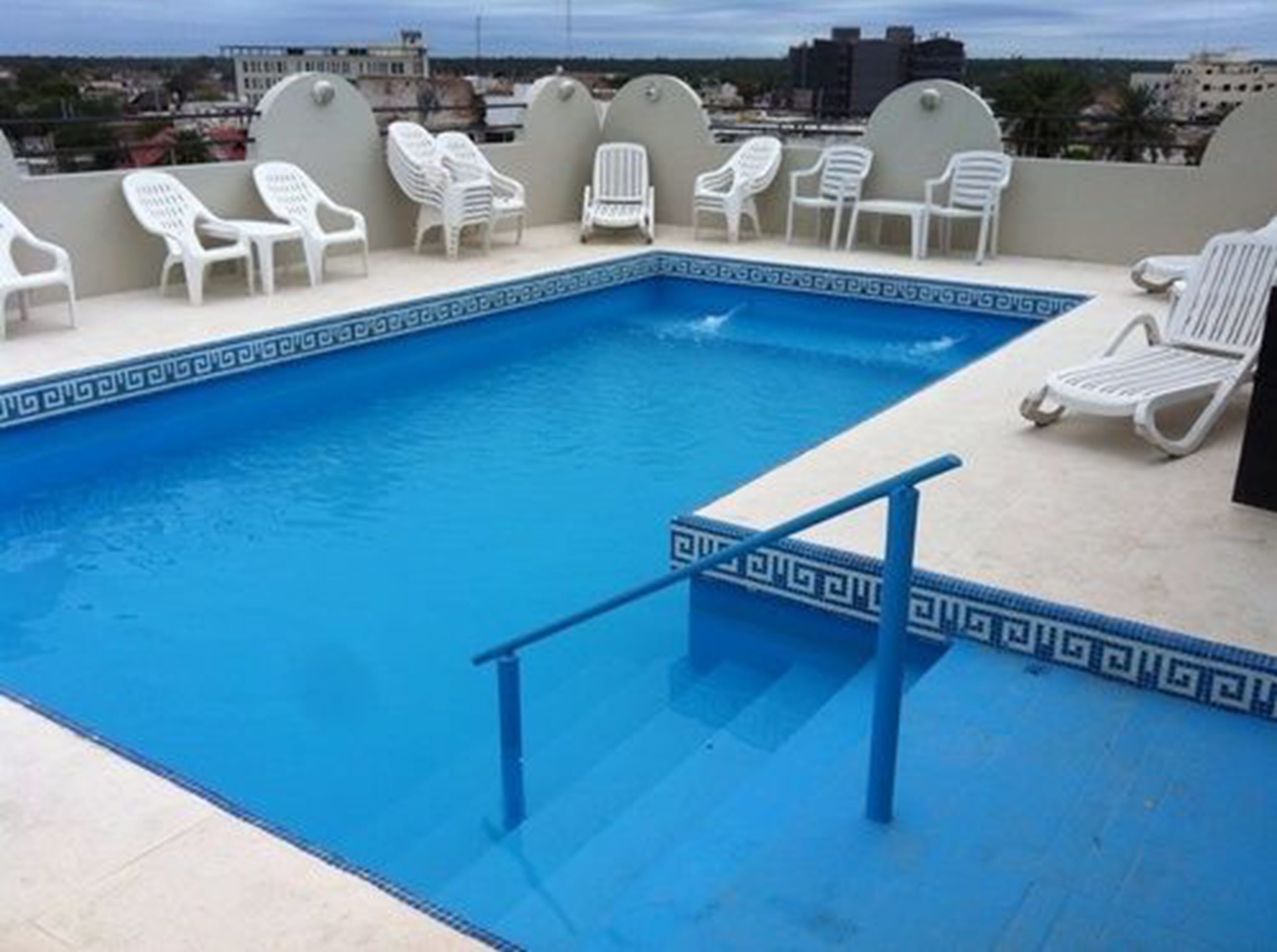 Outdoor pool, open 10:00 AM to 11:00 PM, pool umbrellas