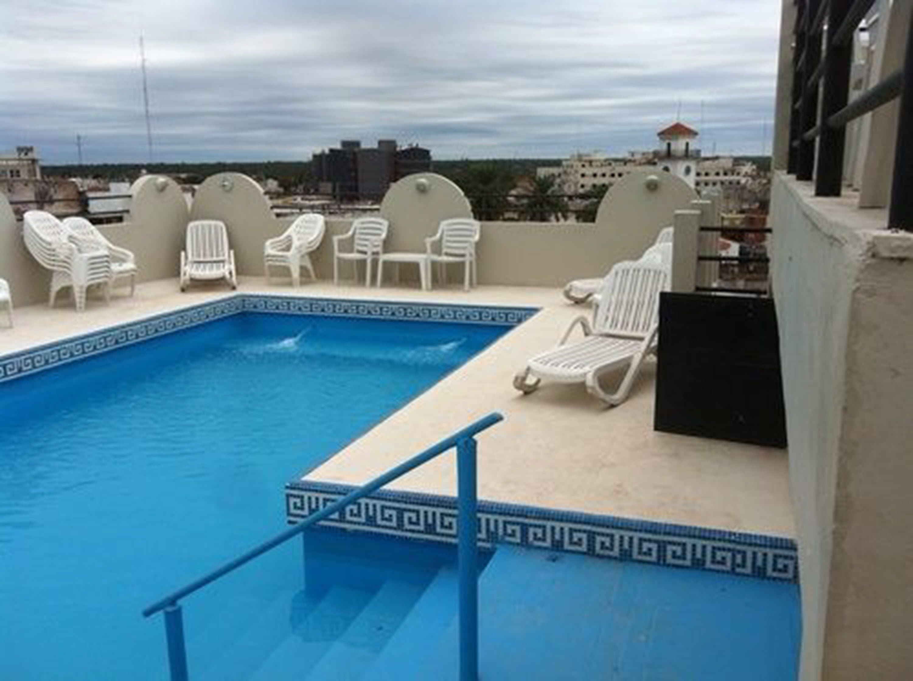 Outdoor pool, open 10:00 AM to 11:00 PM, pool umbrellas