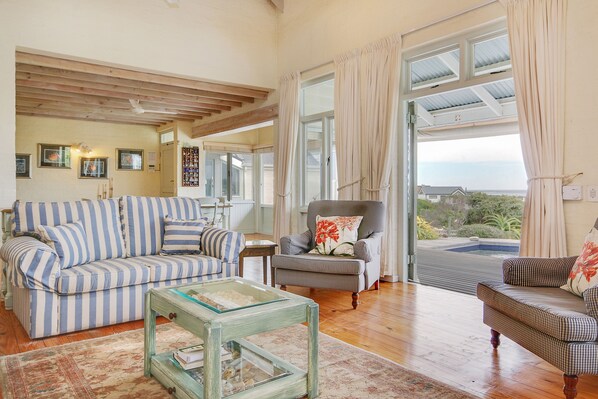 Deluxe Villa, 4 Bedrooms | Living room | Flat-screen TV, fireplace - Baleen Beach House (Cape Town)